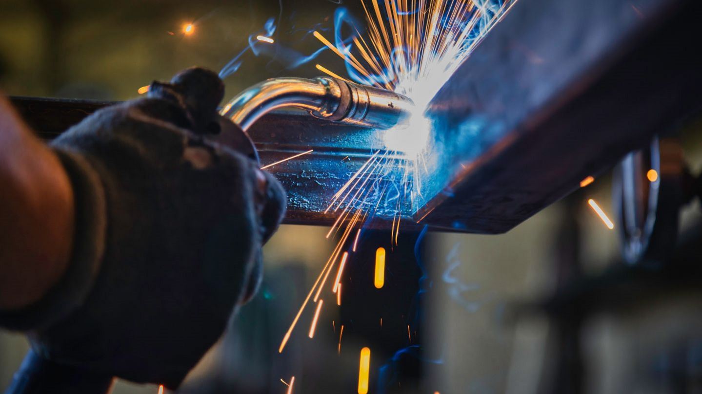 Welder in Action Working on Carbon Steel